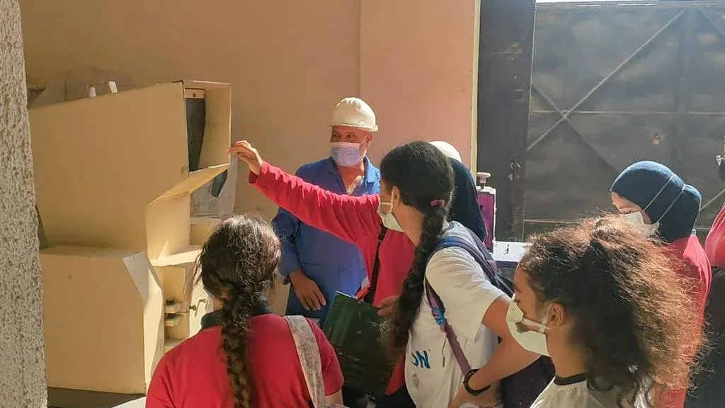 Students learning about e-waste recycling on a visit to EERC