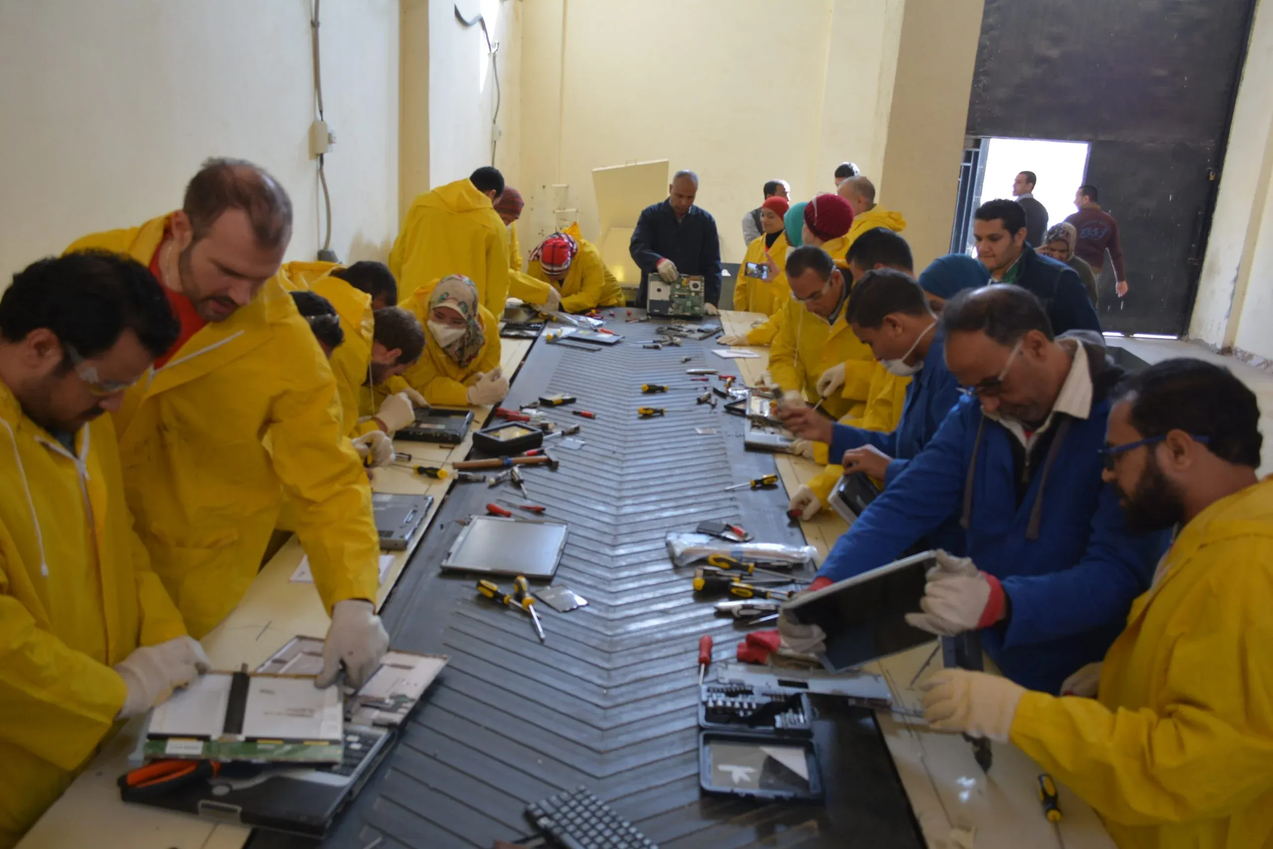 EERC team dismantling IT equipment on the recycling line